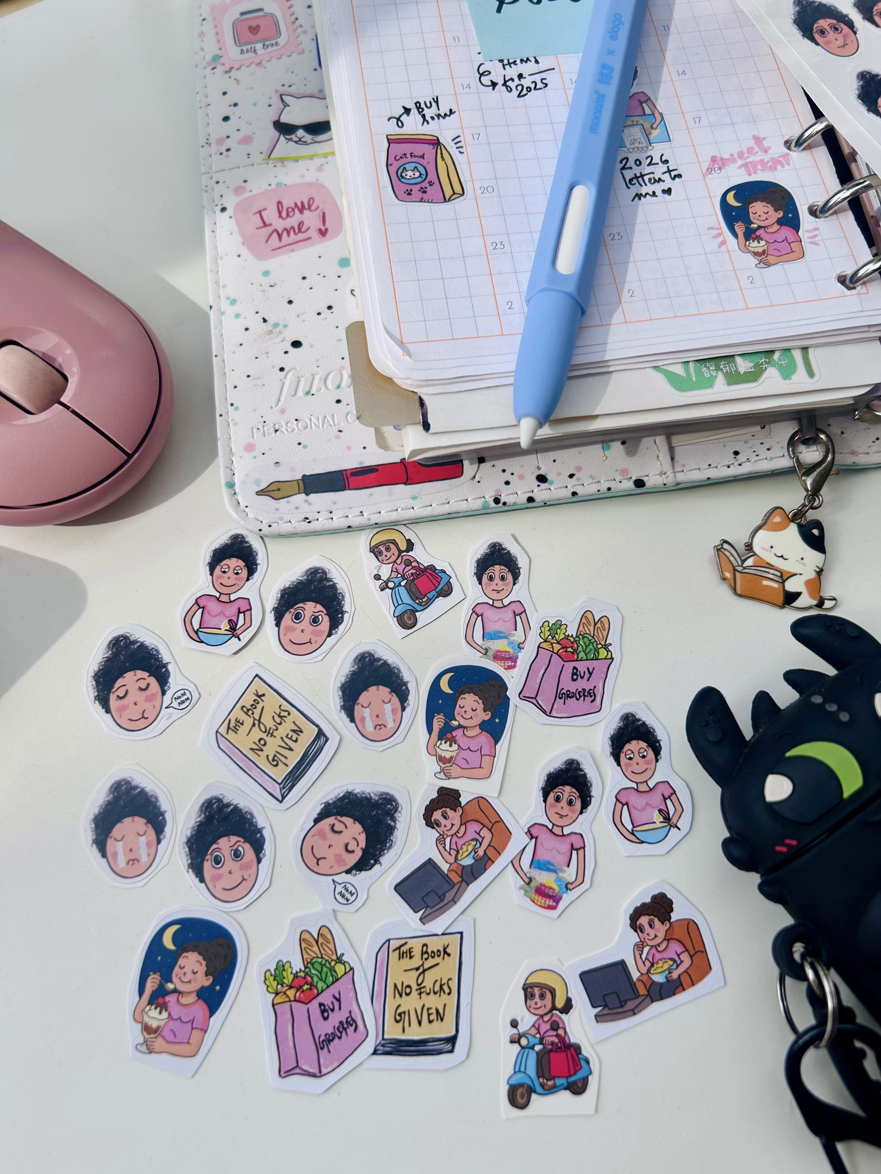 a sample pack of all the favourtie stickers - smug, crying, running errands, baking, doing laundry at curvy noodle for planners using atelier neorah and alica souza journals